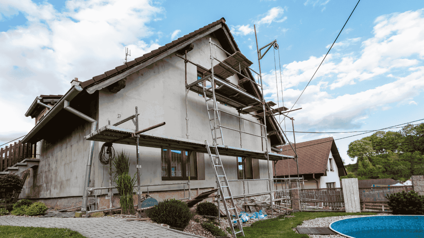 An older home undergoing a significant roof remodel.